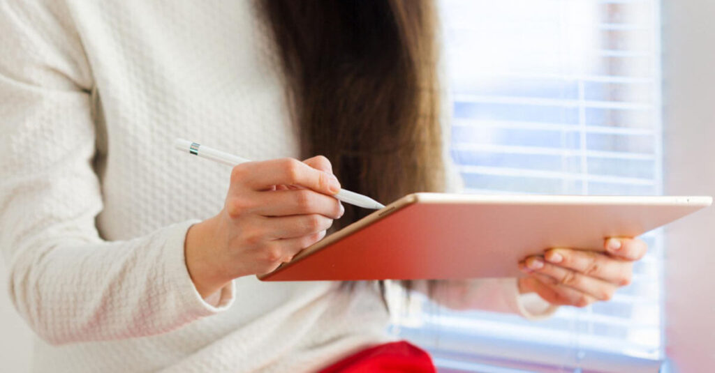 Woman checking the checklist of the task done in efficient cleaning tips